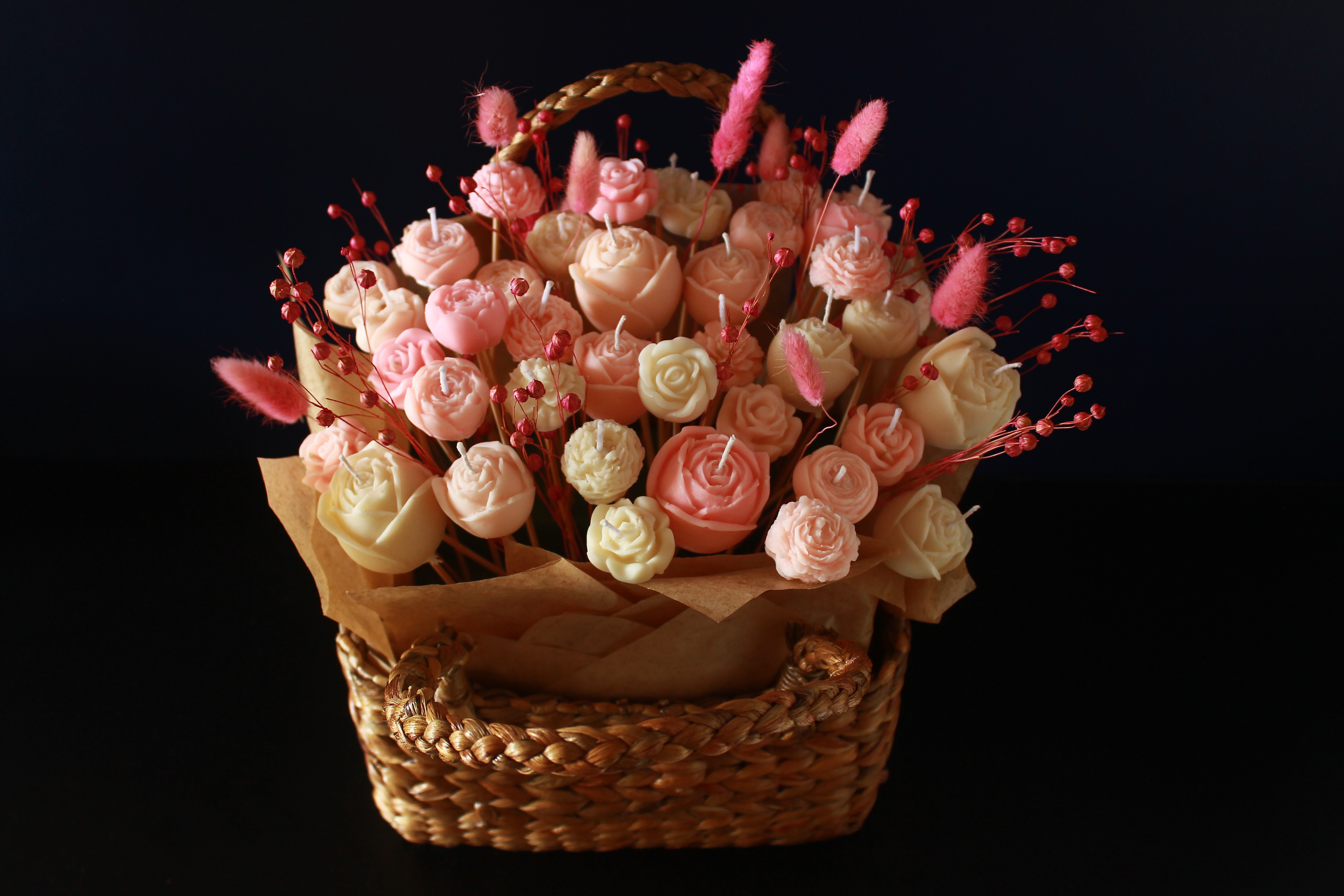 Rose-shaped candles arranged in gift basket